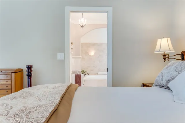 a bathroom with a granite countertop sink a mirror and a shower