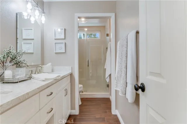 a bedroom with a large bed and a large window