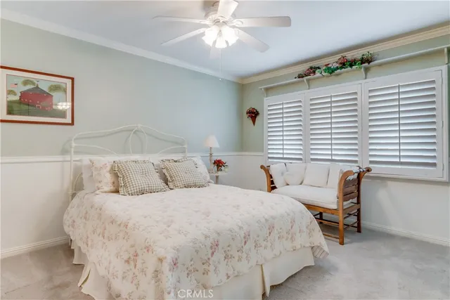 a view of a livingroom with workspace and a window