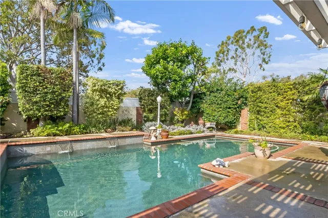 a view of a swimming pool with a yard