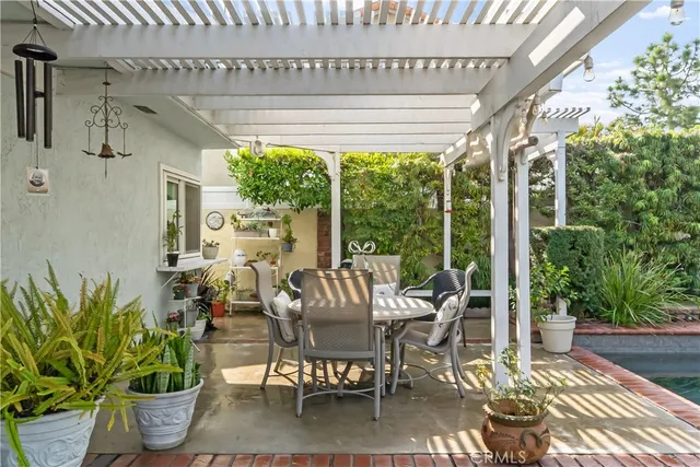a view of an outdoor dining space with furniture window