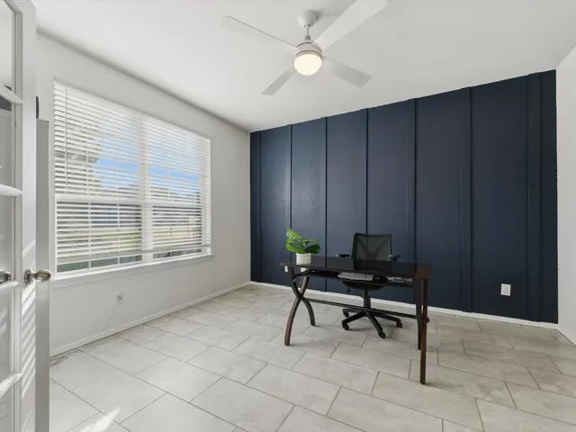 a view of a livingroom with furniture and a window