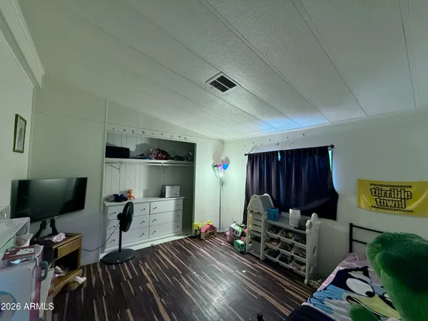 a bedroom with furniture and a window