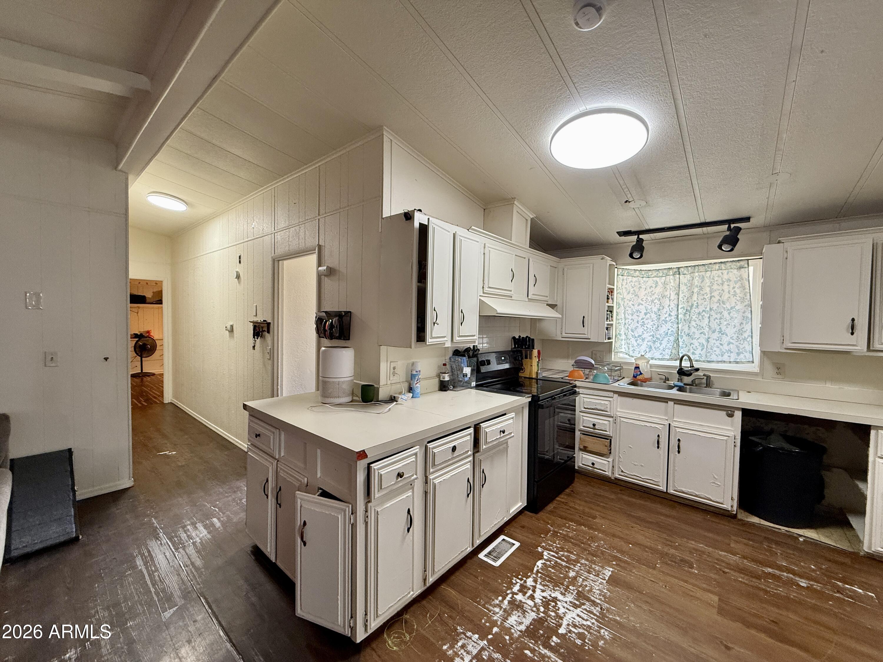 28 East 300th Pima, AZ 85543 - Photo 14 of 20 a kitchen with stainless steel appliances a sink a stove a refrigerator and cabinets