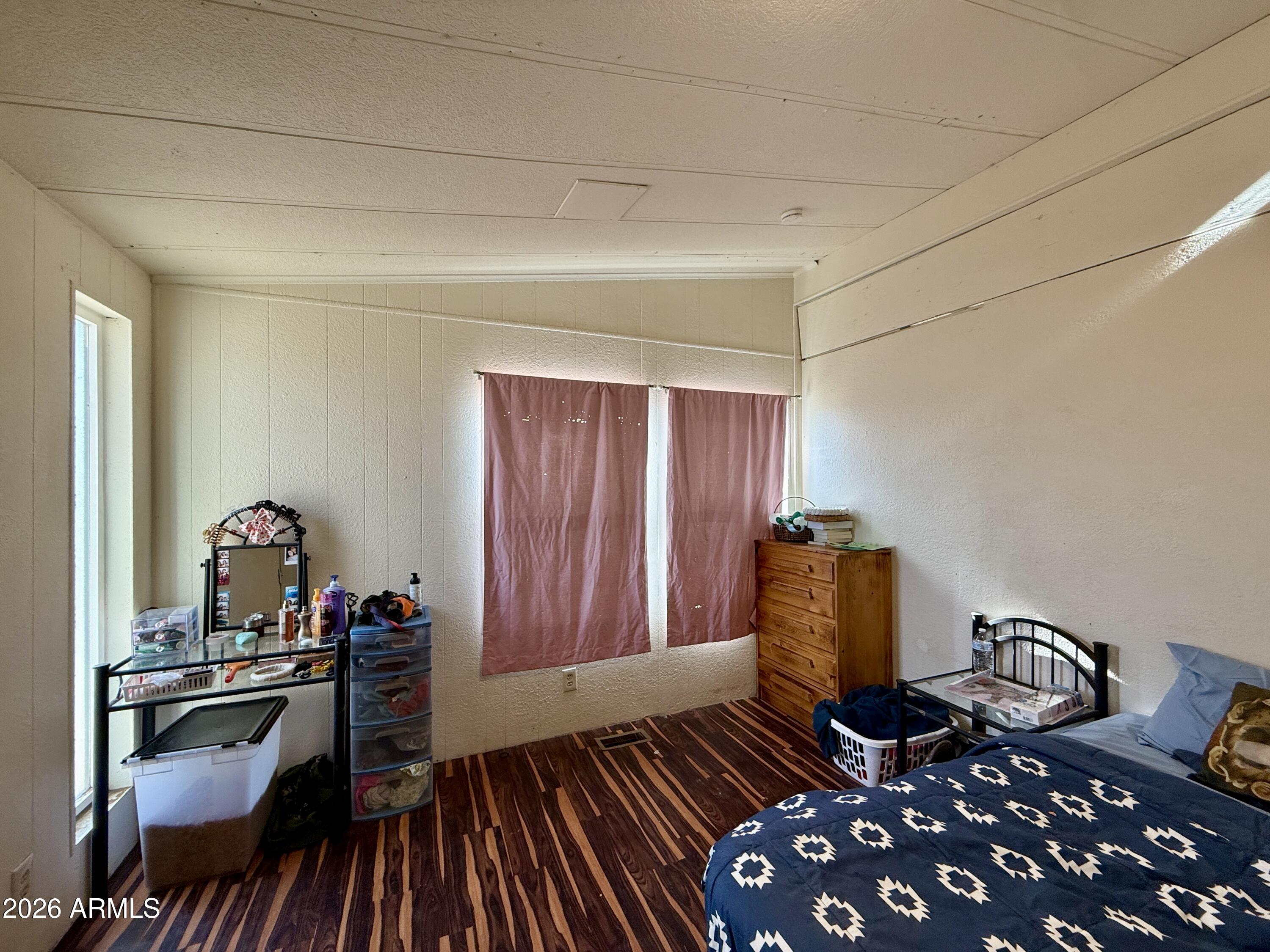 28 East 300th Pima, AZ 85543 - Photo 5 of 20 a bedroom with furniture and wooden floor