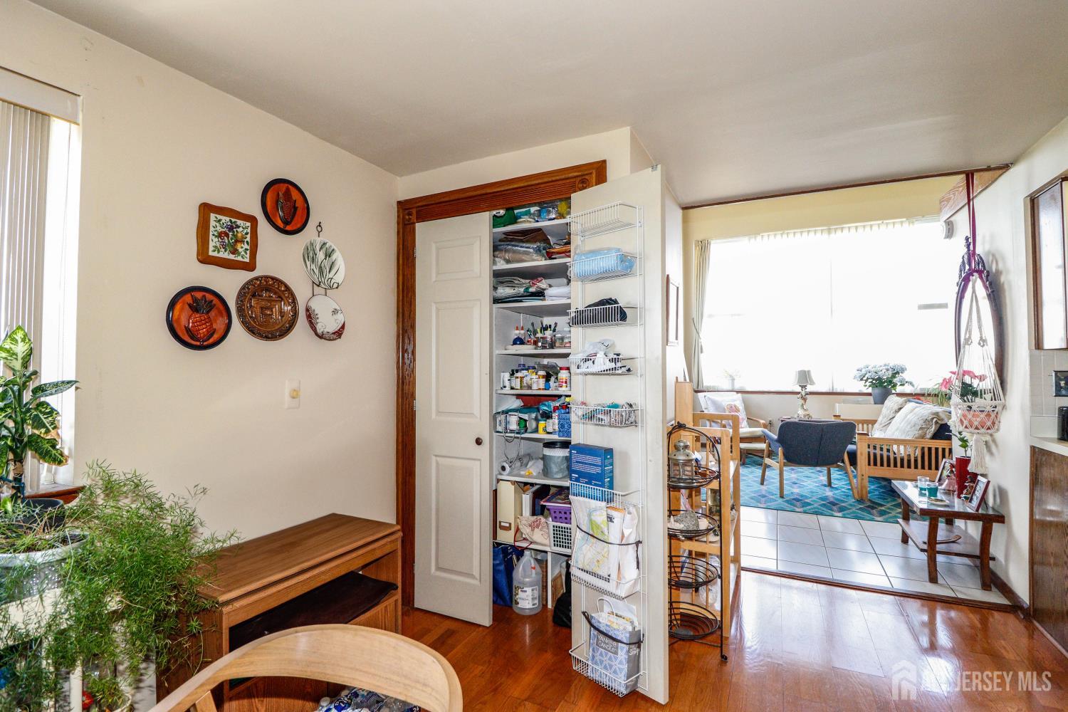 40 Fayette Street, Unit 57 Perth Amboy, NJ 08861 - Photo 10 of 33 a room with furniture and a floor to ceiling window