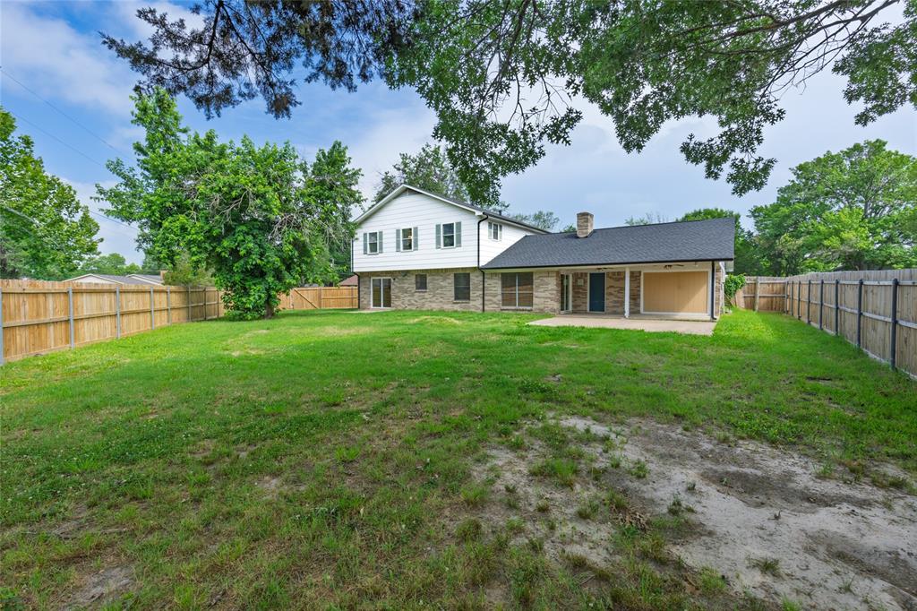 2820 Bois D'Arc Street Commerce, TX 75428 - Photo 37 of 40 a front view of a house with yard and green space