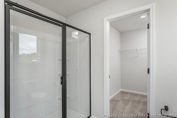 28 Rider Street Broadway, NC 27505 - Photo 6 of 22 an empty room with mirror in closet and a bathroom
