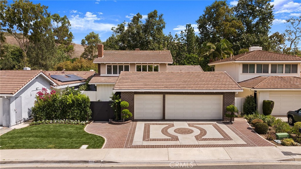 a view of a white house with a yard