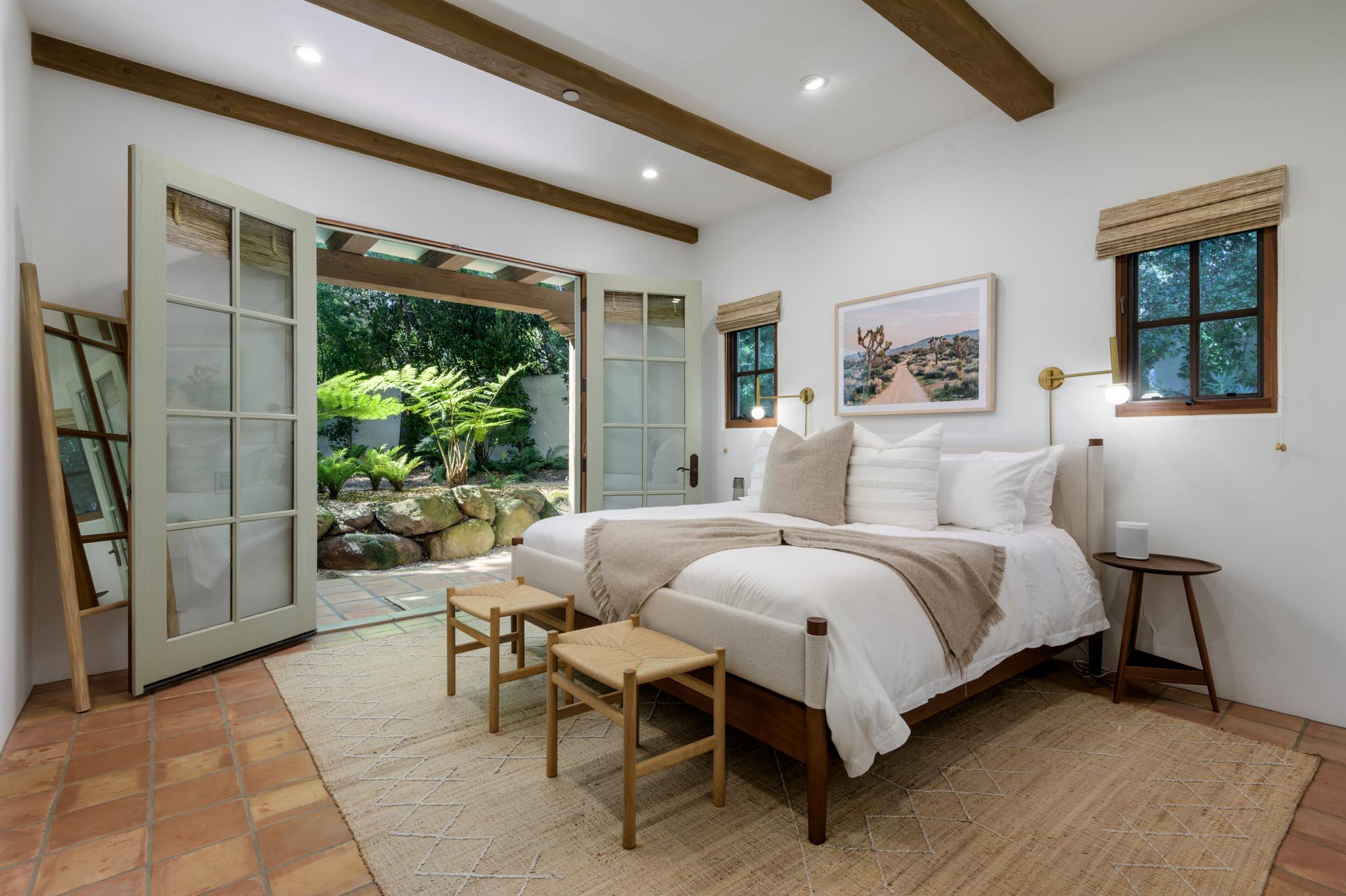 849 Ashley Road Montecito, CA 93108 - Photo 11 of 28 a bedroom with a bed and a painting on the wall