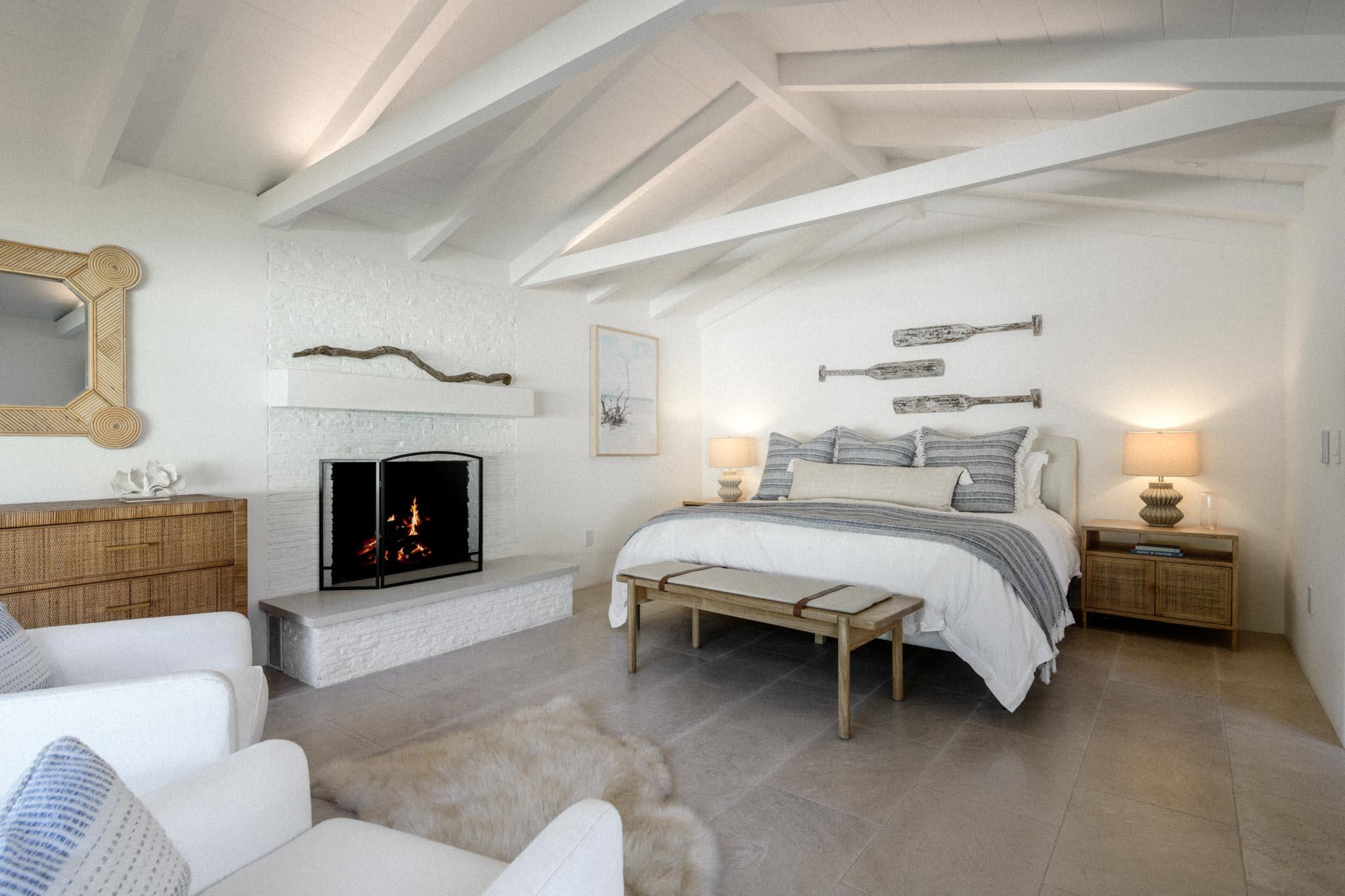 849 Ashley Road Montecito, CA 93108 - Photo 22 of 28 a spacious bedroom with a bed and a fireplace