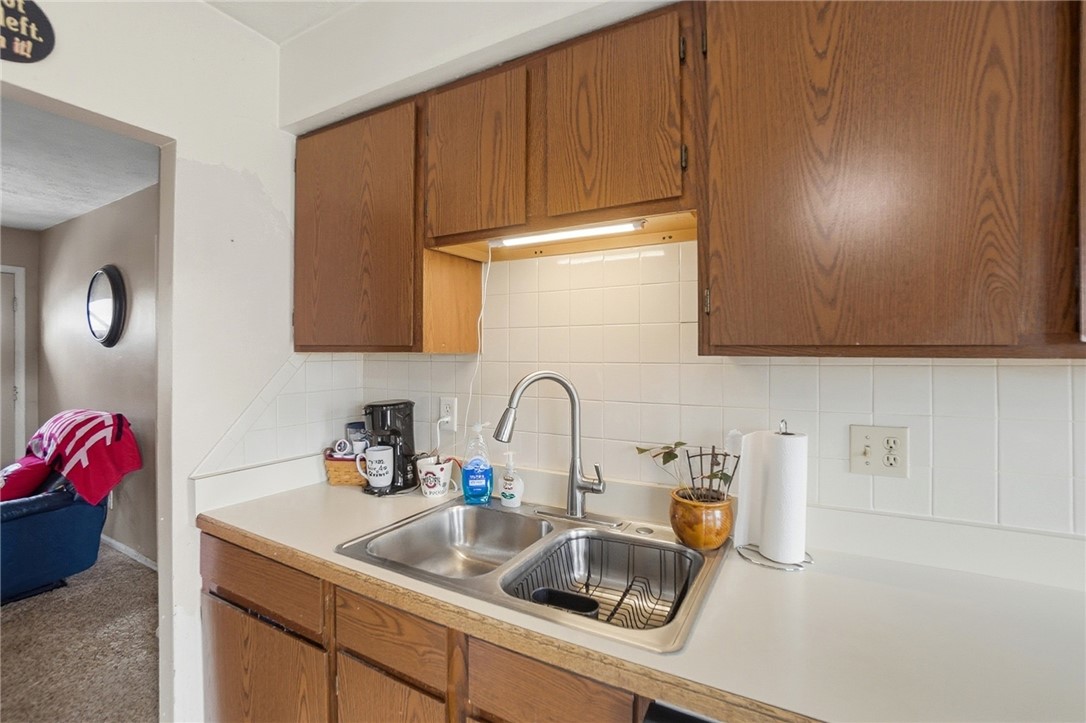 4780 Old Salem Road Englewood, OH 45322 - Photo 10 of 30 This functional kitchen features ample cabinet space and a practical double-basin sink.