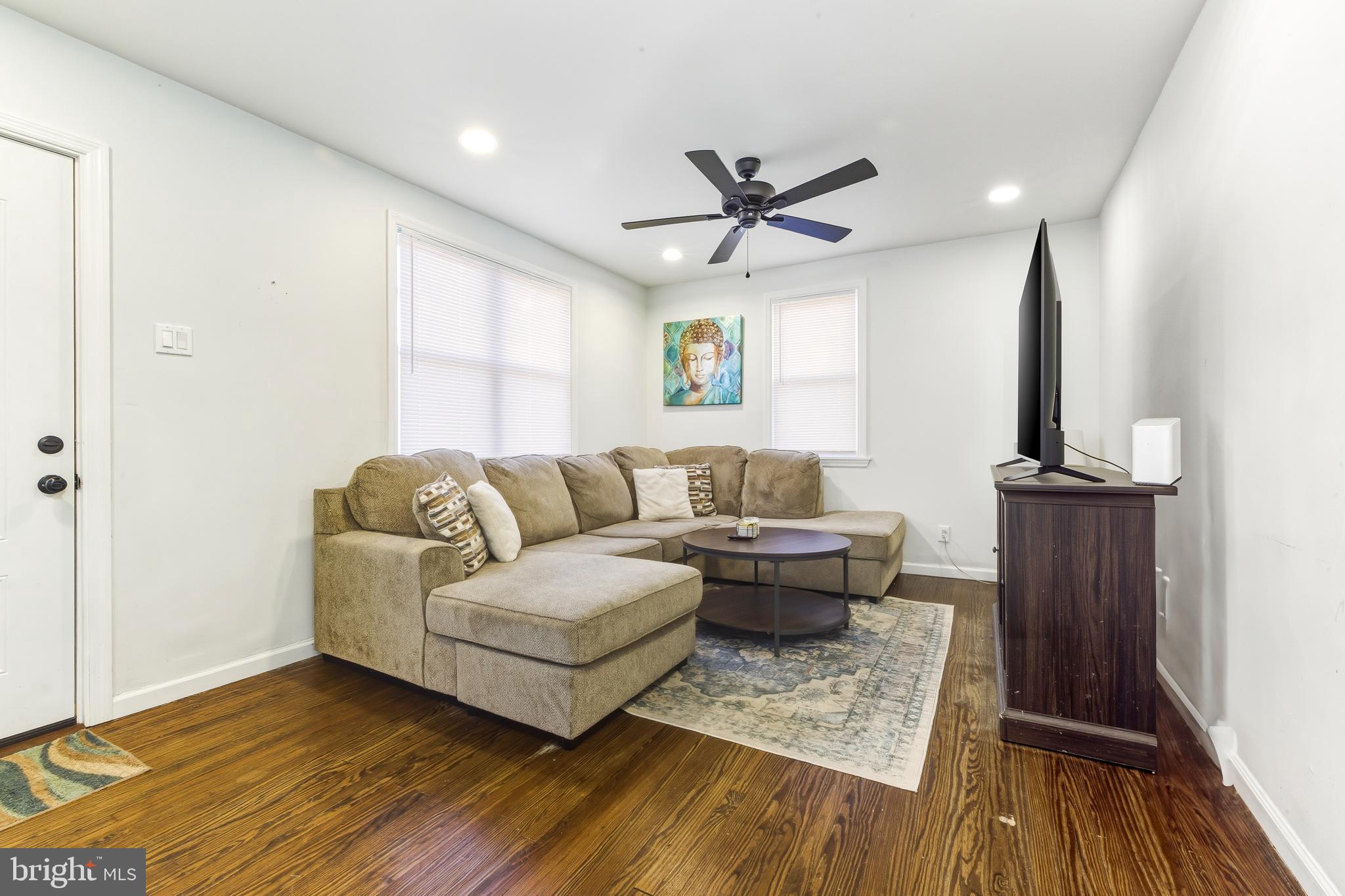 1287 Clements Bridge Road Woodbury, NJ 08096 - Photo 4 of 16 a living room with furniture and a wooden floor