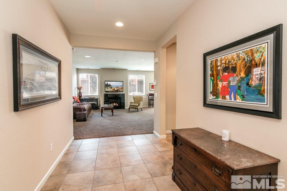 10755 Cedar Rock Drive Reno, NV 89521 - Photo 3 of 22 a view of a livingroom with furniture and a workspace