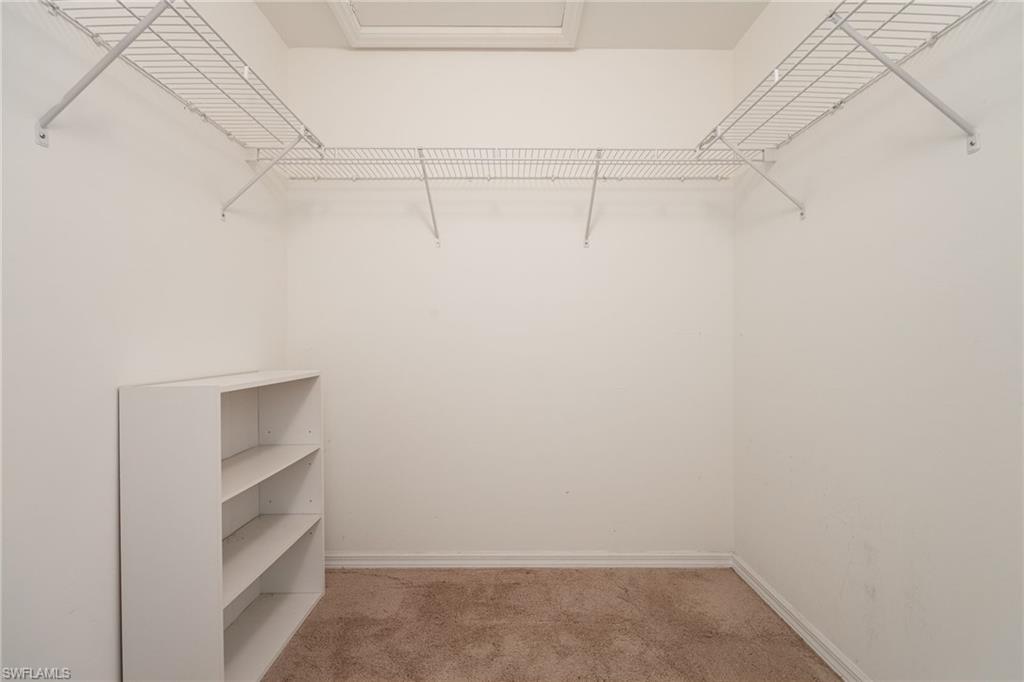 2770 Cypress Trace Circle, Unit 2425 Naples, FL 34119 - Photo 16 of 35 a view of an empty walk in closet