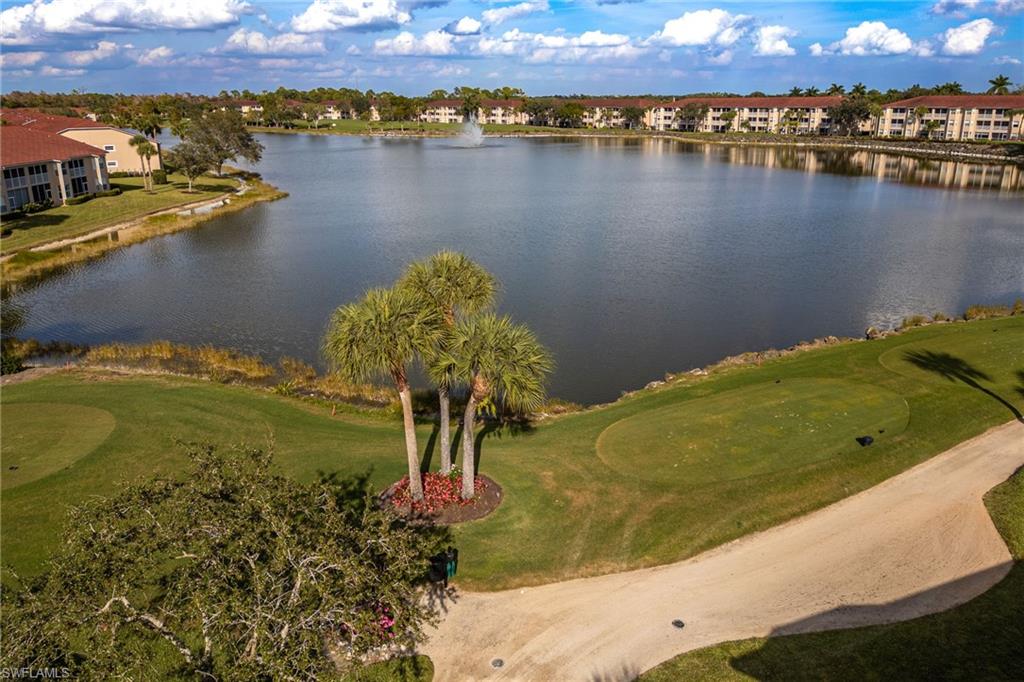 2770 Cypress Trace Circle, Unit 2425 Naples, FL 34119 - Photo 2 of 35 a view of a lake with a mountain