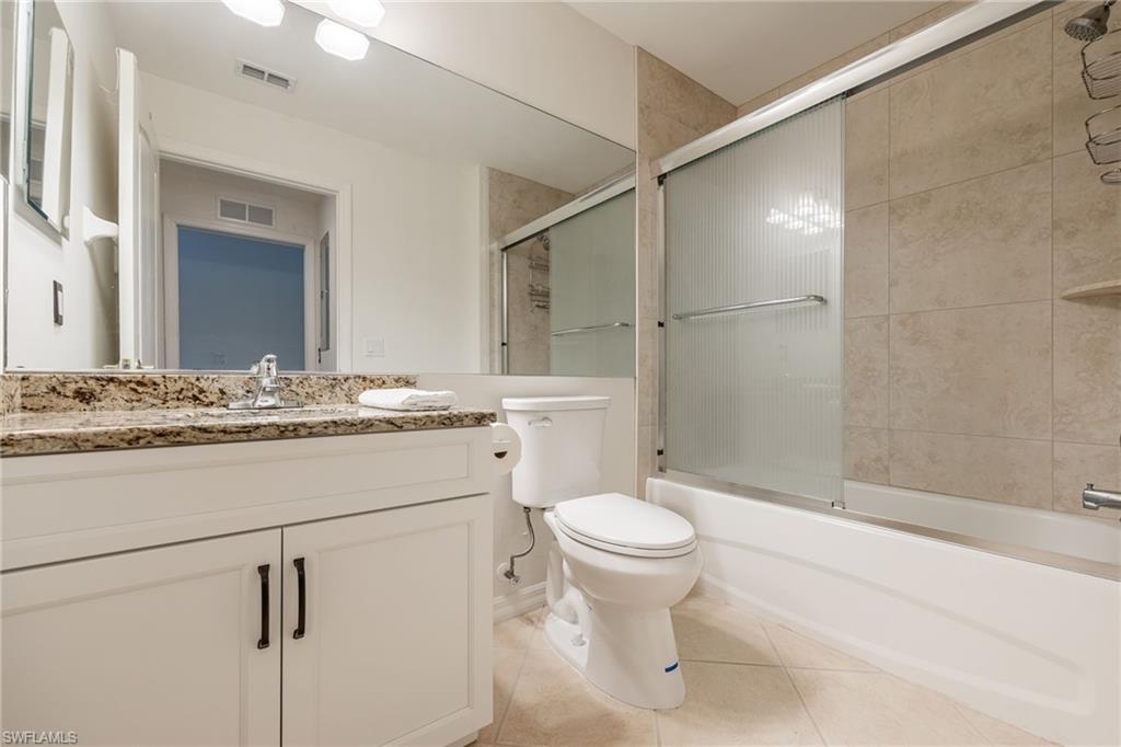 2770 Cypress Trace Circle, Unit 2425 Naples, FL 34119 - Photo 21 of 35 a bathroom with a sink toilet and shower
