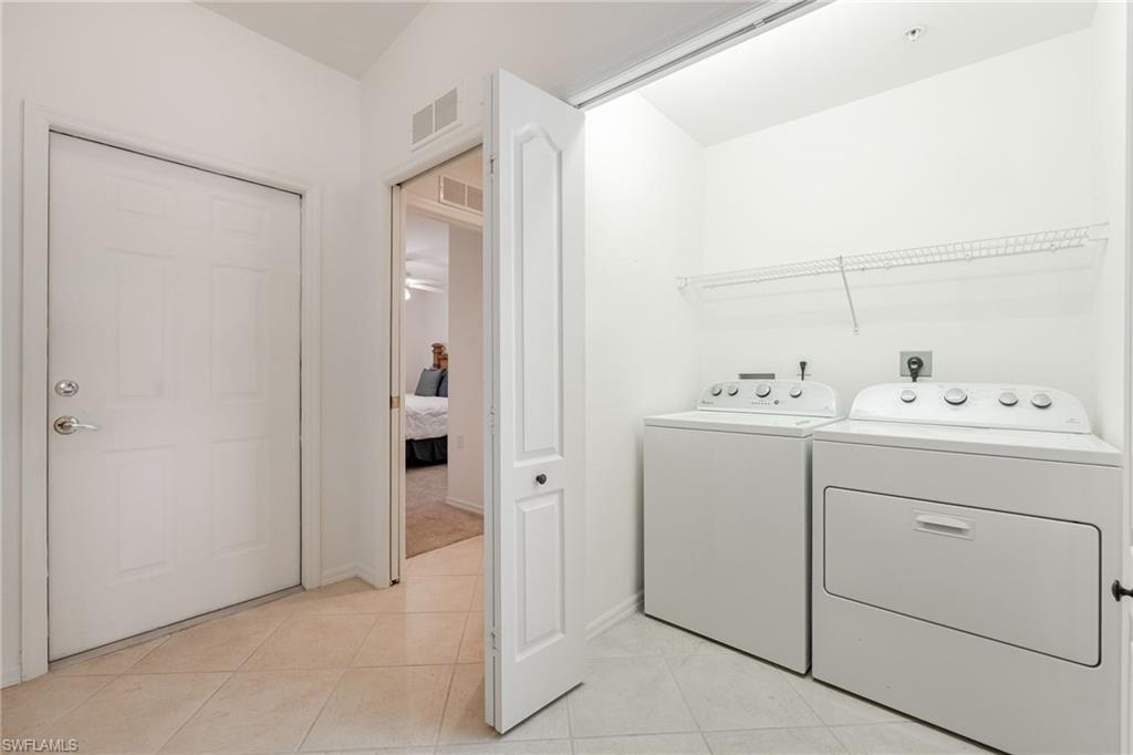 2770 Cypress Trace Circle, Unit 2425 Naples, FL 34119 - Photo 23 of 35 a bathroom with a sink vanity and mirror