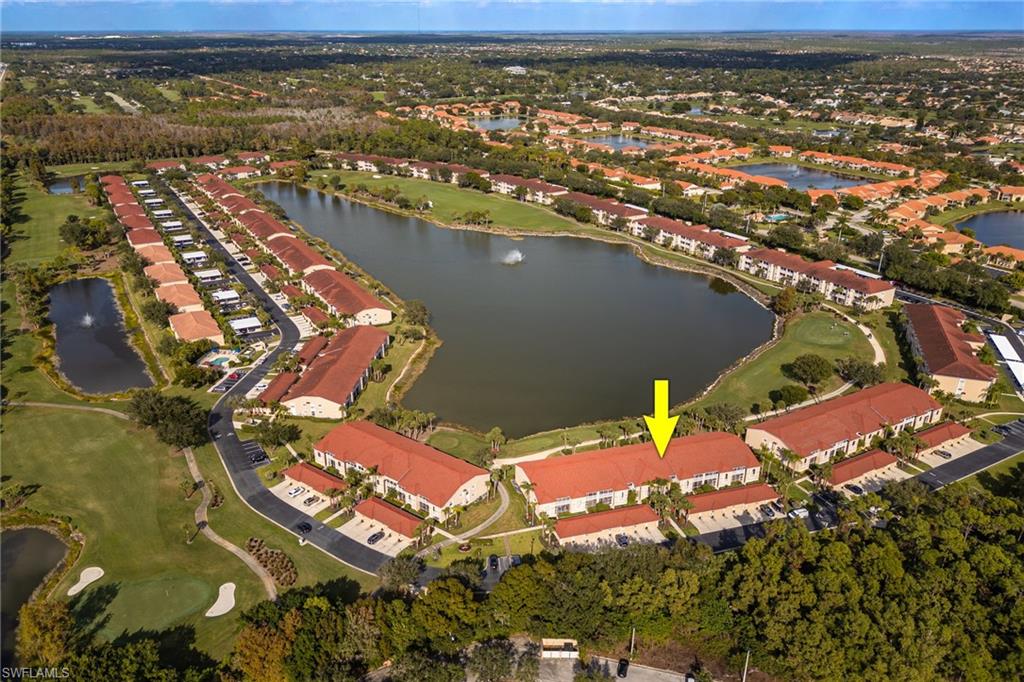 2770 Cypress Trace Circle, Unit 2425 Naples, FL 34119 - Photo 24 of 35 an aerial view of residential houses with outdoor space