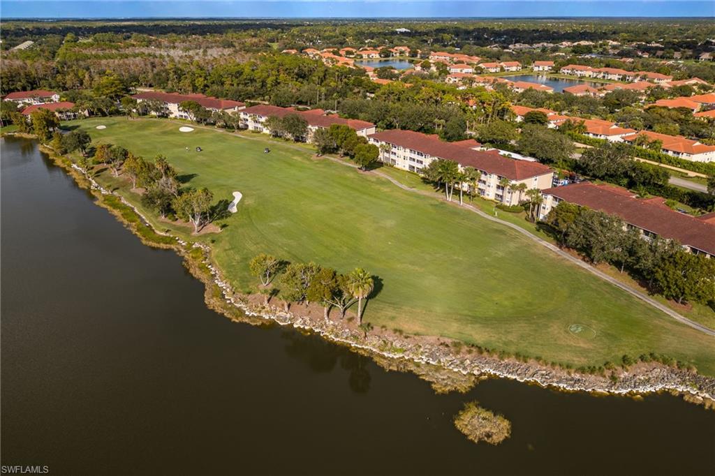 2770 Cypress Trace Circle, Unit 2425 Naples, FL 34119 - Photo 26 of 35 a view of a lake