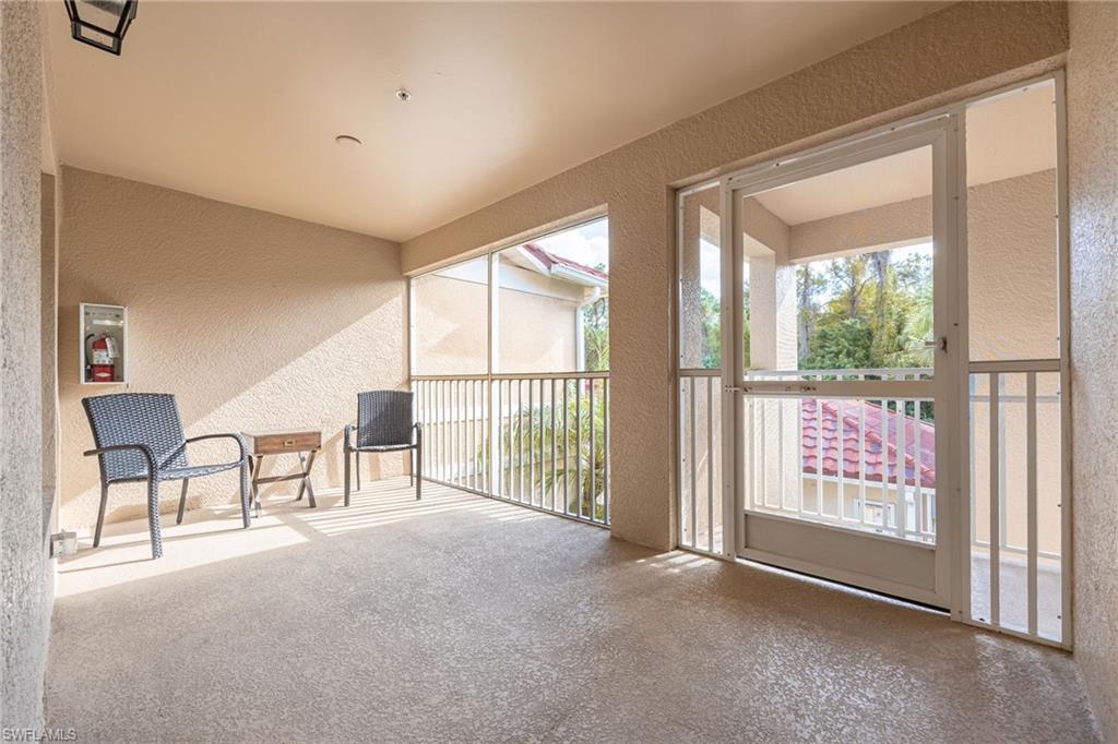 2770 Cypress Trace Circle, Unit 2425 Naples, FL 34119 - Photo 5 of 35 a view of an empty room with windows
