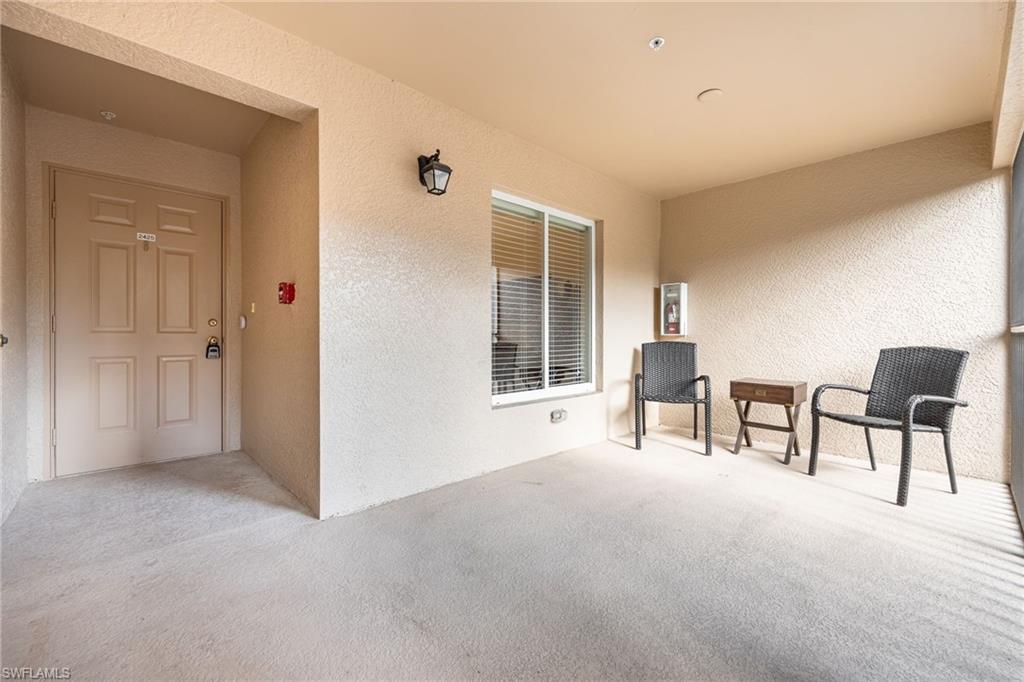 2770 Cypress Trace Circle, Unit 2425 Naples, FL 34119 - Photo 6 of 35 a view of livingroom with furniture and windows