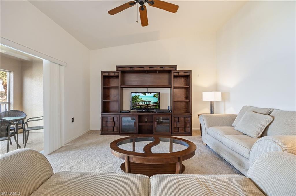 2770 Cypress Trace Circle, Unit 2425 Naples, FL 34119 - Photo 8 of 35 a living room with furniture and a wooden floor