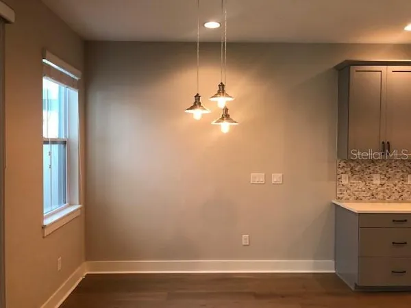 a view of a livingroom with wooden floor