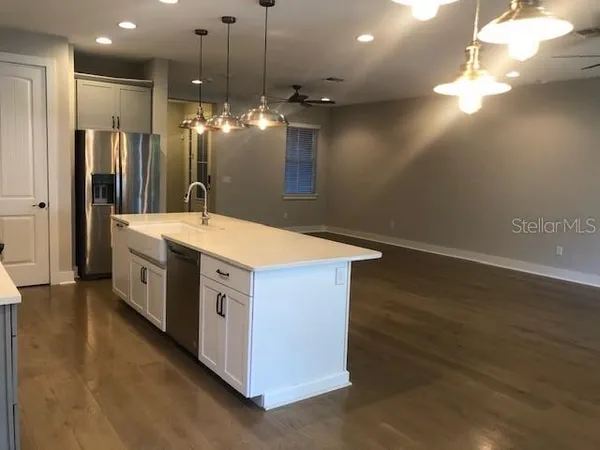 a spacious bathroom with a double vanity sink and a mirror