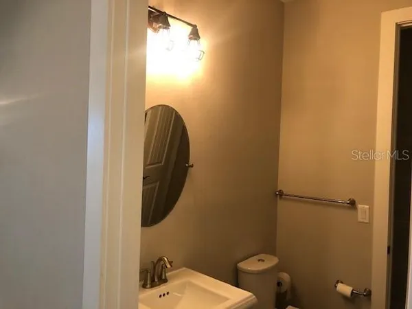 a bathroom with a toilet and a sink