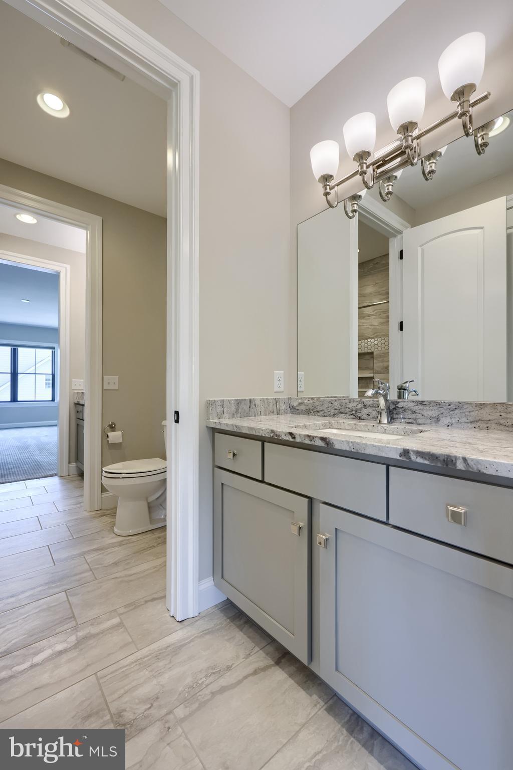 428 Southampton Drive Lititz, PA 17543 - Photo 50 of 60 a bathroom with a granite countertop sink a toilet and mirror