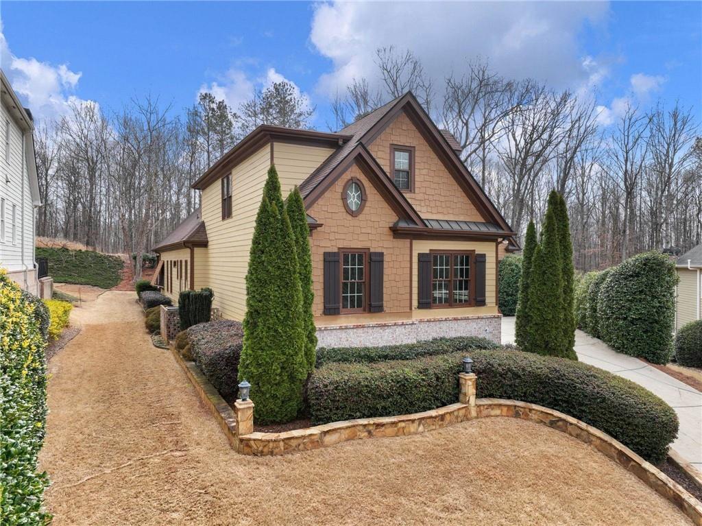 6147 Golf View Court Jefferson, GA 30549 - Photo 4 of 73 a front view of a house with a yard and garage