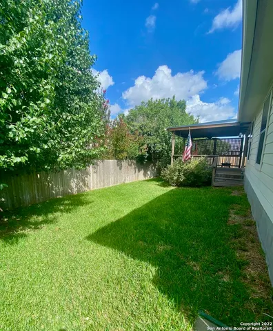 a view of a yard in front of house with a yard
