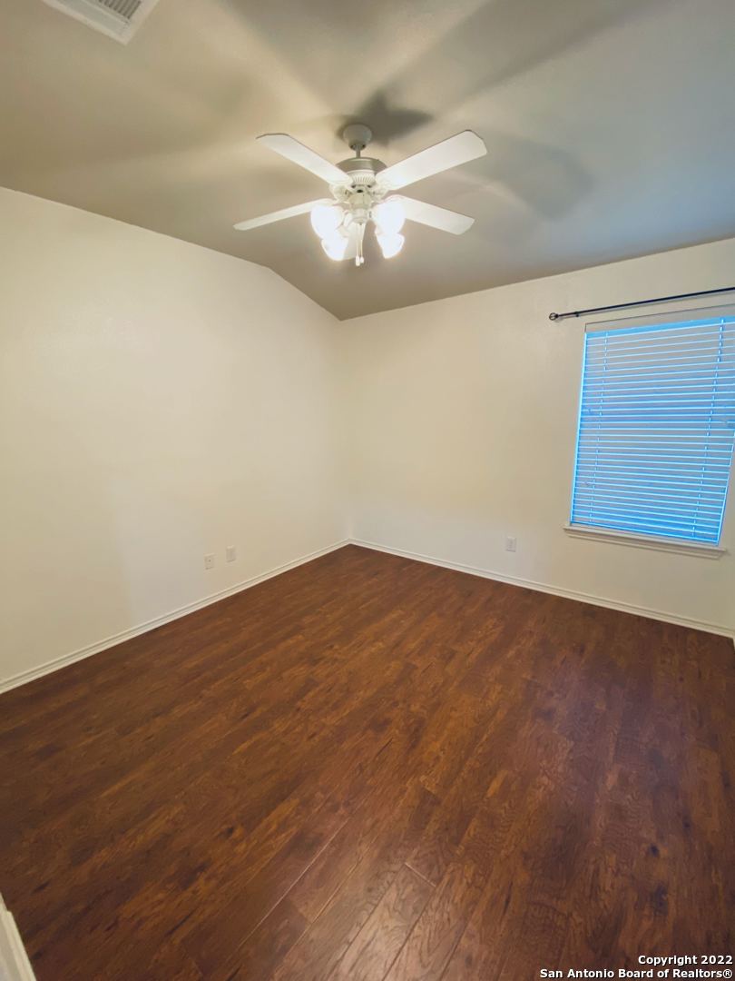 707 Point Sunset San Antonio, TX 78253 - Photo 9 of 15 an empty room with wooden floor and fan