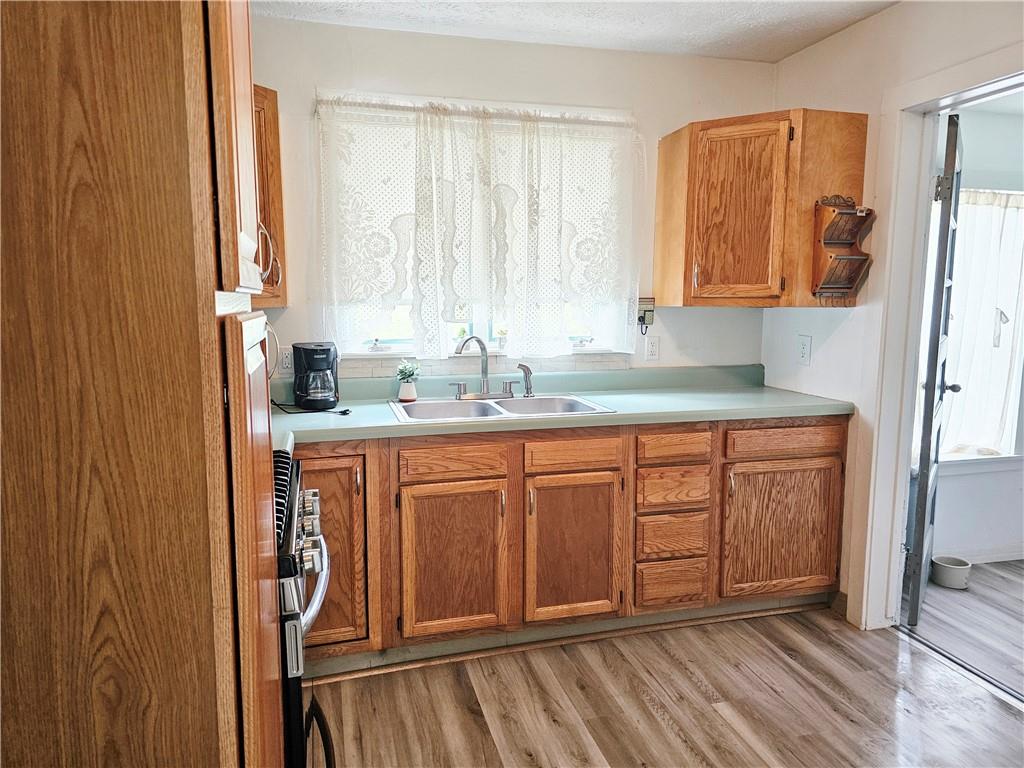 117 Little Rock Road Kittanning, PA 16201 - Photo 5 of 23 a bathroom with a sink a mirror and a window