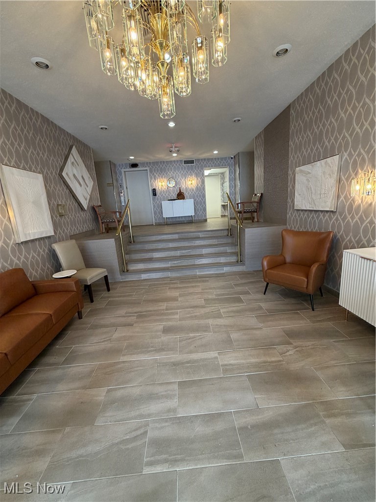 3066 Kent Road, Unit 407 Stow, OH 44224 - Photo 16 of 16 Lobby featuring wallpapered walls and stairs