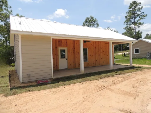 a view of a house with a patio