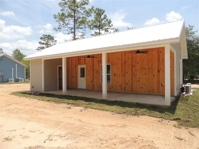 a view of a house with a snow in the yard