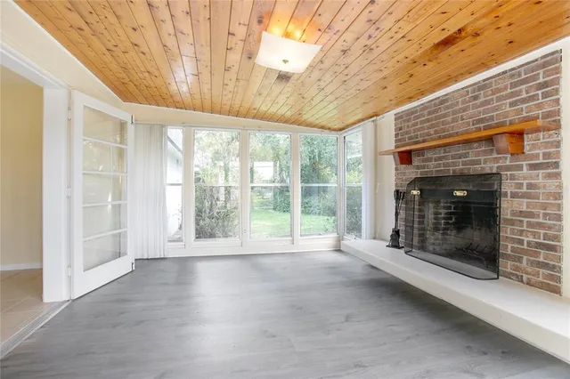 a view of an empty room with a fireplace