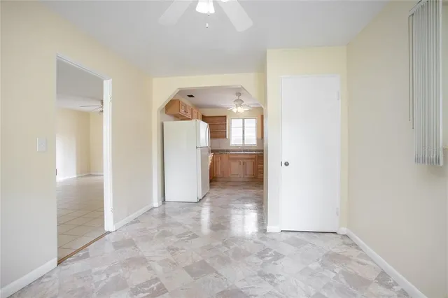 an empty room with a bathroom and a sink