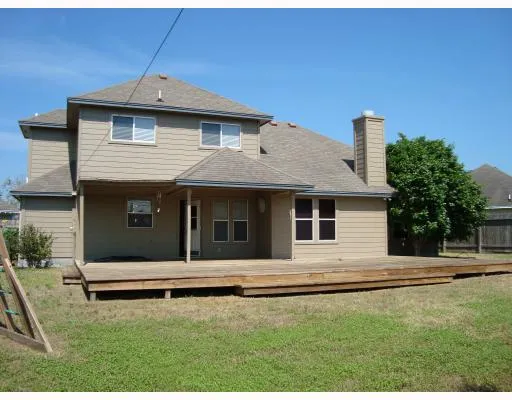 a front view of a house with garage