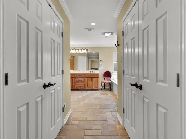 a view of a hallway with a livingroom view