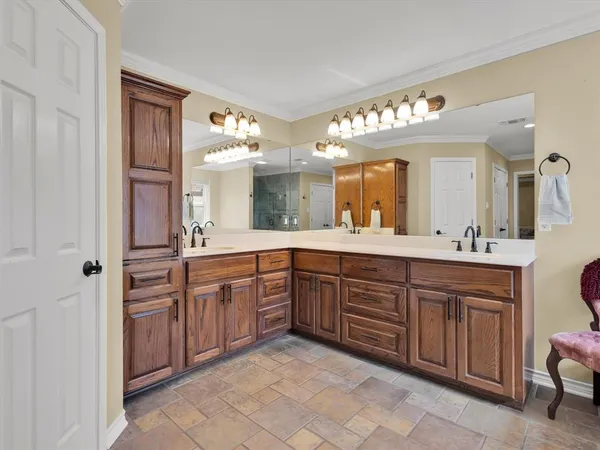 a spacious bathroom with a granite countertop sink and a mirror