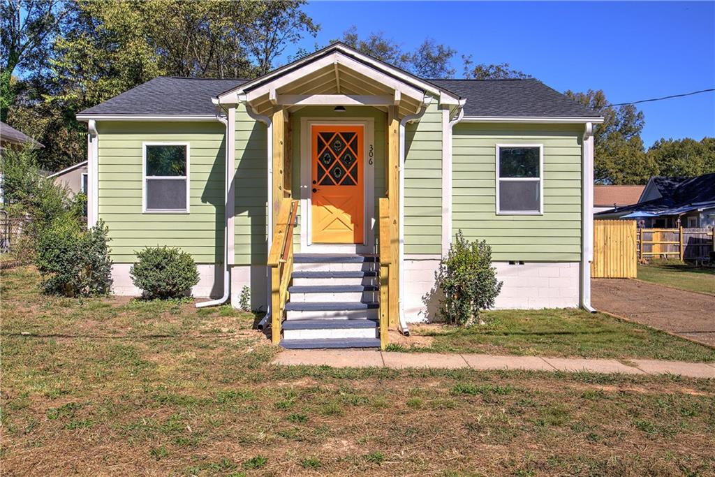 306 Camp Street Northeast Rome, GA 30161 - Photo 1 of 1 a front view of a house with a yard