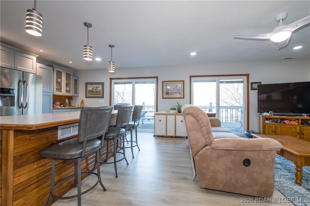 30857 Berry Road Stover, MO 65078 - Photo 7 of 58 Living room on main level opens to kitchen