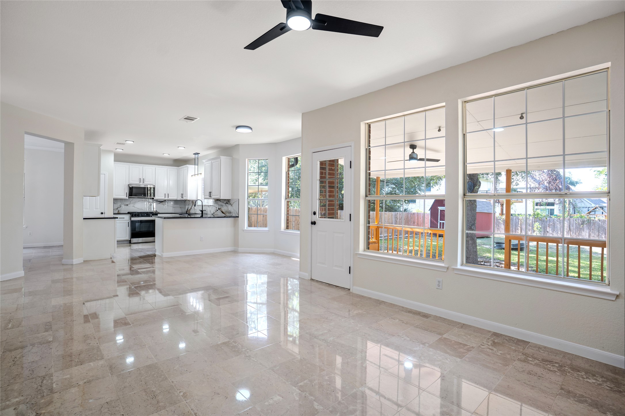 13102 Hunters Chase Drive Austin, TX 78729 - Photo 17 of 39 a view of kitchen with stainless steel appliances refrigerator oven large window and cabinets