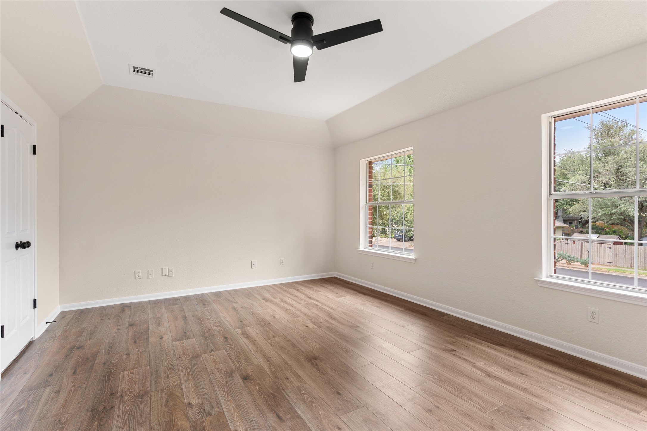 13102 Hunters Chase Drive Austin, TX 78729 - Photo 26 of 39 wooden floor in an empty room with a window