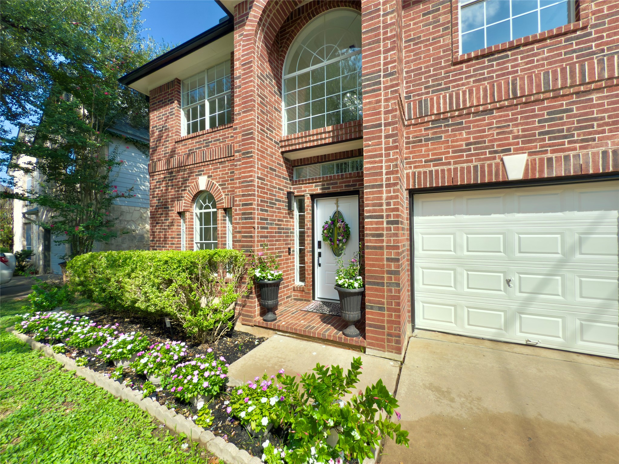 13102 Hunters Chase Drive Austin, TX 78729 - Photo 5 of 39 a view of a house with a yard and potted plants