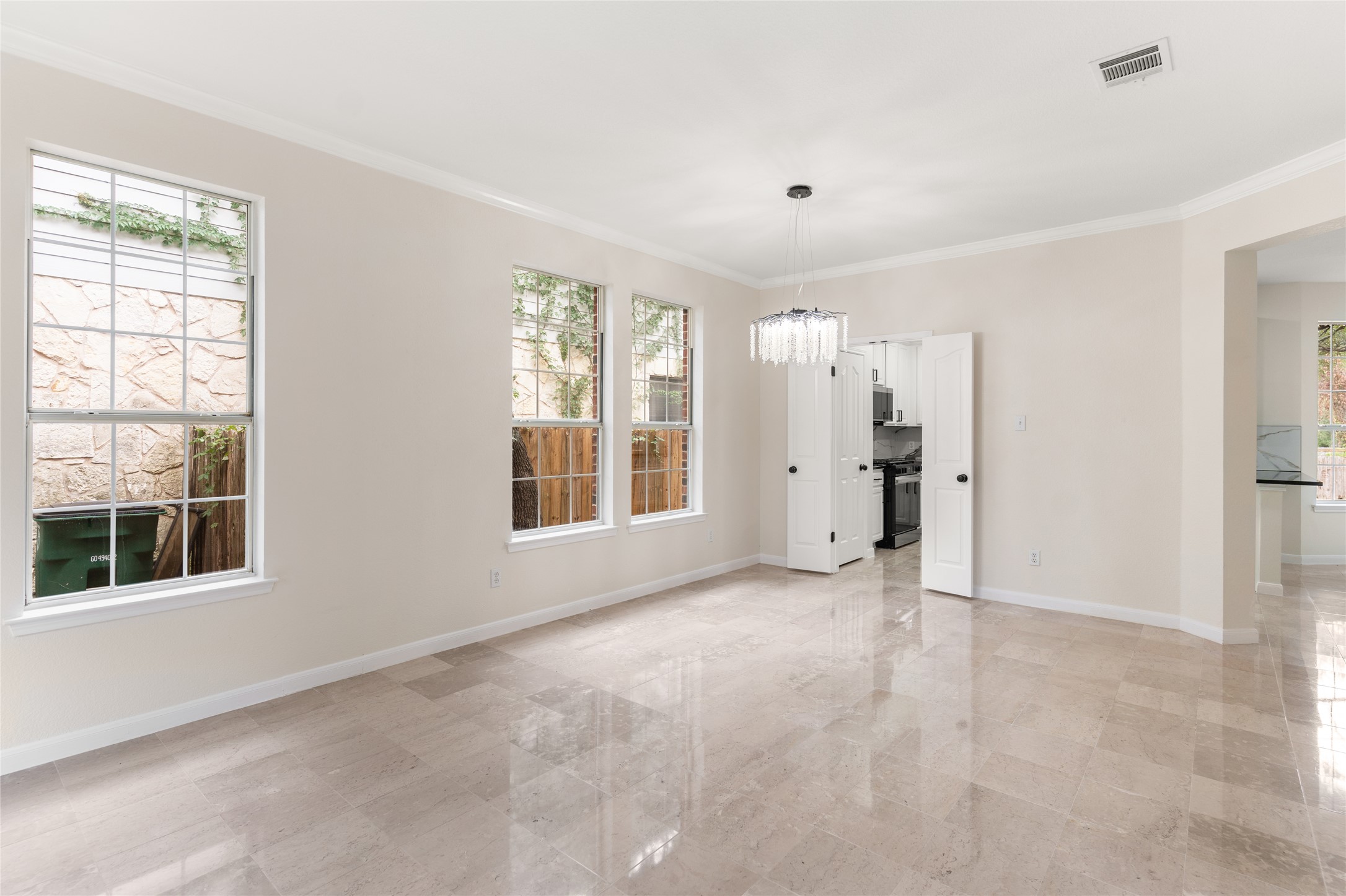13102 Hunters Chase Drive Austin, TX 78729 - Photo 8 of 39 a view of an empty room with a window
