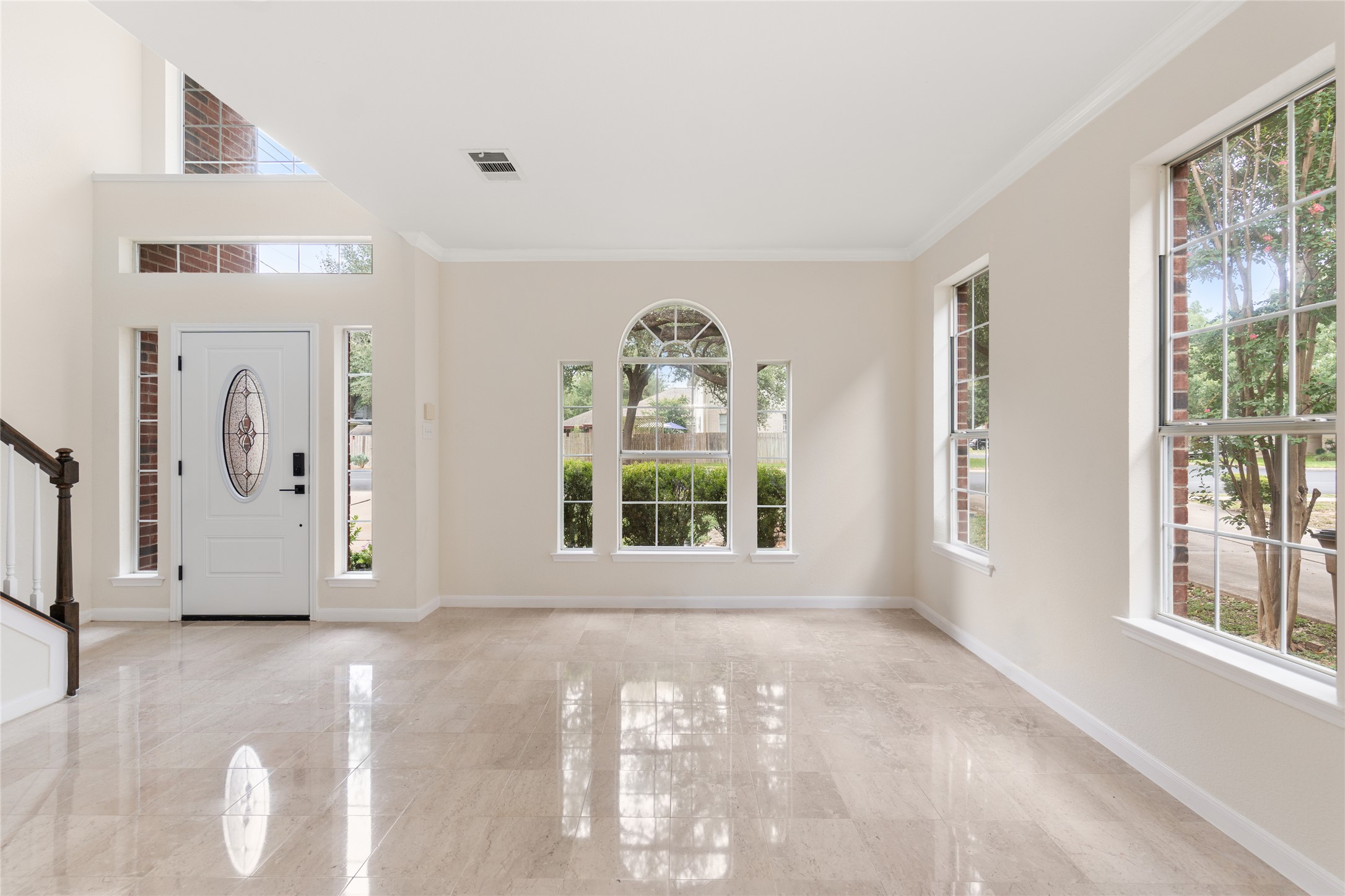 13102 Hunters Chase Drive Austin, TX 78729 - Photo 9 of 39 a view of a big room with windows and chandelier